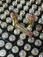 10mm Auto 180 grain XTP @ 1,300 FPS.