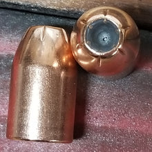 10mm Auto 200 grain XTP @ 1,010 FPS.