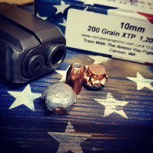 10mm Auto 200 grain XTP @ 1,010 FPS.